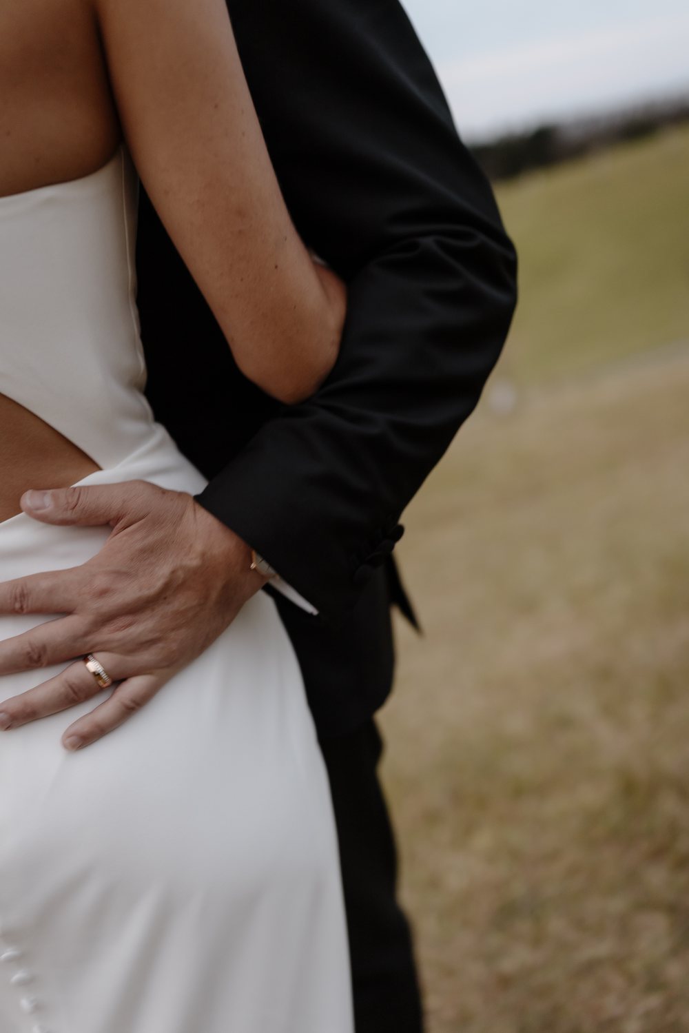 Bride and groom in a field