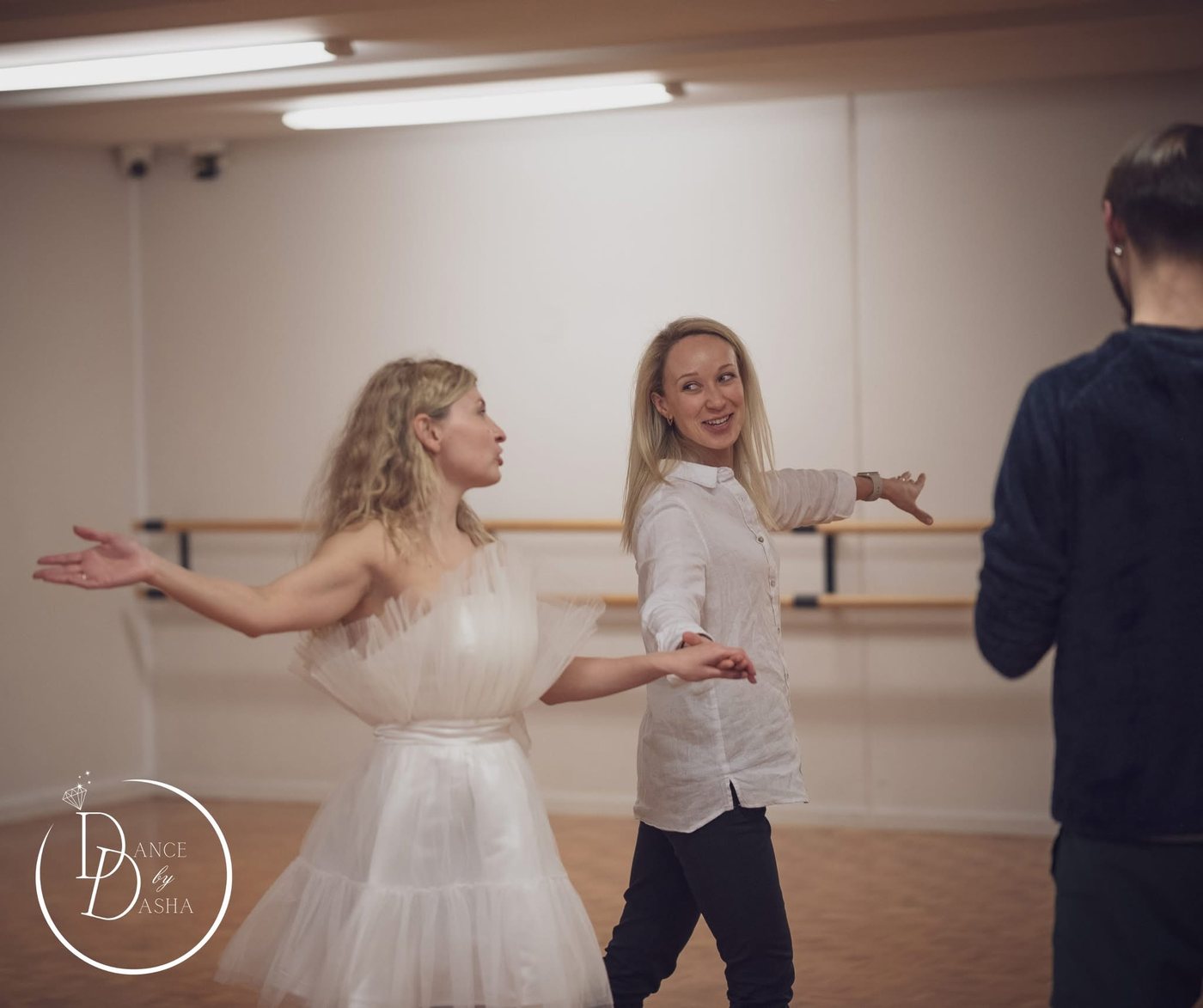 Dasha teaching a couple their first dance